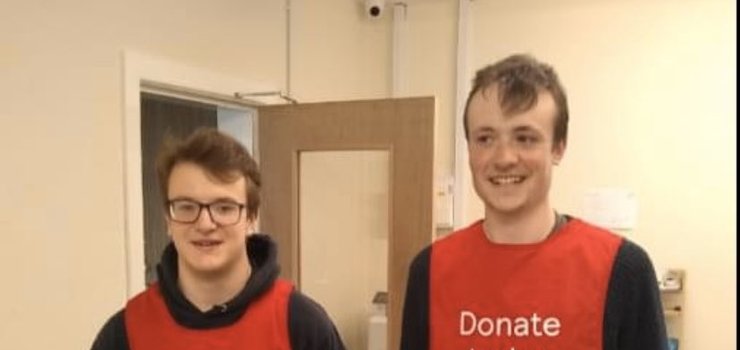 Image of Current and former students volunteer at the Food Bank